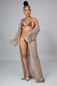 Detail of bohemian long hollow crochet cardigan and dark brown bikini swimwear set