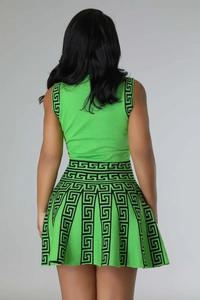 Detailed back view of green two-piece knit set with black Greek key pattern borders