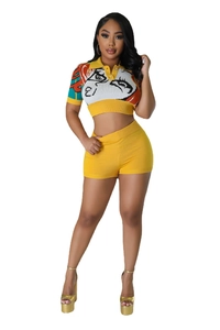 Detail of yellow knit crop top with abstract face print and matching high waist shorts