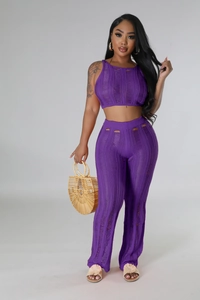 Detail of purple knit two-piece set with chic hollow-out patterns and ribbed texture