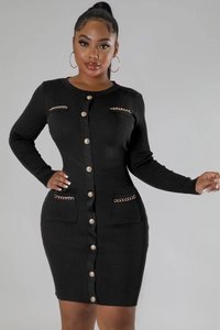 Close-up of black ribbed knit dress with gold buttons and metal chain pocket details
