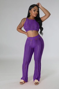 Detail view of purple hollow-out knit fabric texture on a two-piece crop top set