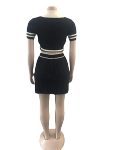 Rear view of black rib-knit two-piece set with white striped edges on a mannequin