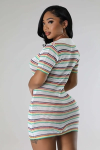 Detail of multi-color striped hollow knit fabric on this white slim mini dress