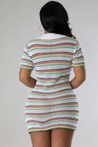 Back view of a slim fit crochet knit dress featuring colorful stripes and hollow texture