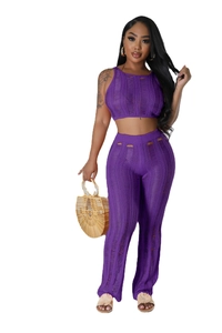 Detail of purple knitted two-piece set featuring hollow-out distressed texture and ribbing