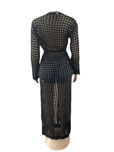 Back view of a black hollow knit long cardigan beach cover-up with a waist belt