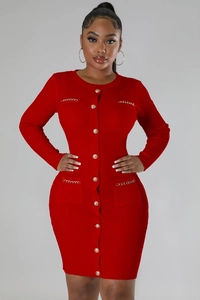 Detail view of dark red knit dress featuring golden chain pockets and metallic buttons