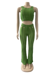 Close-up of green knit two-piece set featuring cutout details and ribbed texture