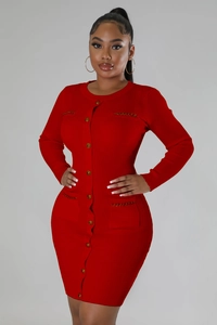 Close-up of red knit dress featuring ribbed texture and decorative gold buttons