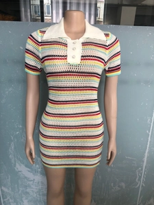 Detail of colorful striped knit mini dress featuring pearl buttons and a contrast polo collar