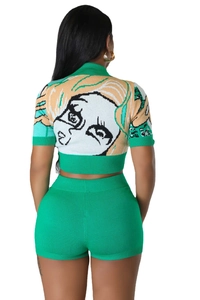 Detailed back view of green knit crop top featuring artistic character portrait jacquard