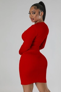 Detail view of red slim fit knitted dress showing high-elastic ribbed texture and bodycon silhouette