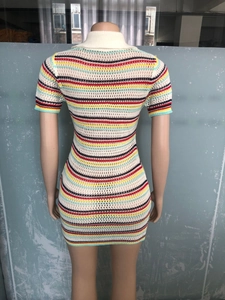 Detail view of colorful striped knit dress showing flexible fabric and slim fit design