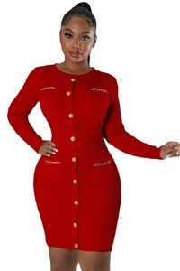 Detail of red ribbed knit dress with gold buttons and elegant metallic chain pockets