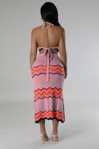 Detail view of the back of a pink zigzag knit two-piece set with a halter top and midi skirt