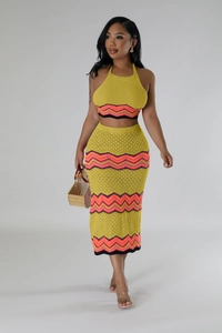 Detail view of the yellow knitted crochet texture and colorful wavy geometric patterns
