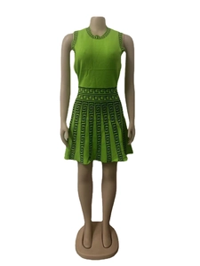 Macro shot of geometric patterns on fluorescent green knitted sleeveless dress detail