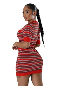 Detail of red and grey horizontal striped knit dress with tight fit and crew neck design