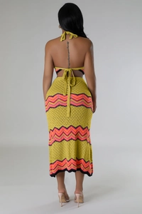 Detail of the open-back crochet knit top with bohemian orange and pink wave patterns