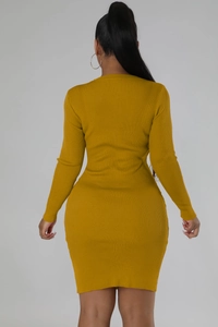 Back view of a ginger yellow slim fit knit mini dress showing ribbed texture and bodycon cut