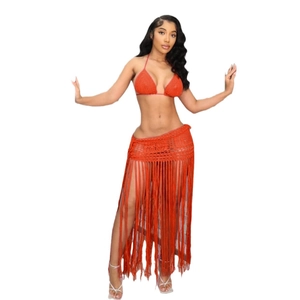 Detail of orange handmade crochet bikini set with long fringe skirt for beachwear