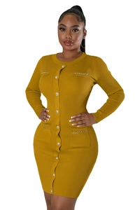 Close-up of mustard yellow knit dress with gold chain pockets and metallic buttons