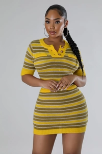 Detail of knit mini dress showing yellow and grey stripes with three buttons on neckline