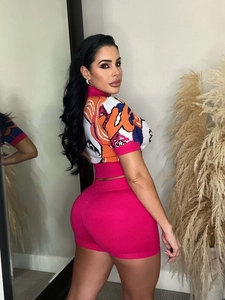 Detailed back view of knit two-piece set featuring figure print top and pink shorts