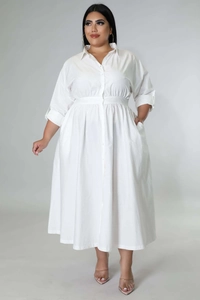 Close-up of white plus size long sleeve shirt dress featuring waist pleats and side pockets