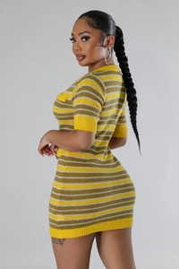 Detail of slim-fit knit dress featuring vibrant yellow and green horizontal stripes pattern