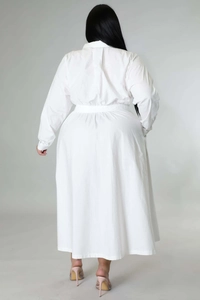 Rear view of plus size white long sleeve shirt dress with waisted cut and large hemline