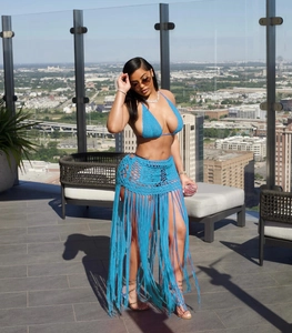 Detail of royal blue crochet beach set with long fringe skirt and mesh hollow design