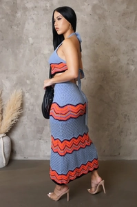 Detail of the blue crochet knit two-piece set featuring wavy orange and purple stripes