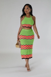 Detailed close-up of neon green knit two-piece set with vibrant zigzag pattern textures