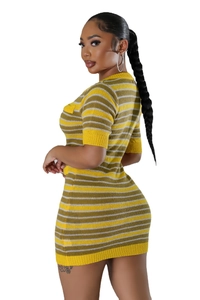 Detail view of striped knit dress featuring yellow, grey, and white horizontal pattern