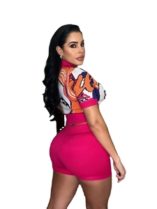 Detailed knit texture and vibrant jacquard portrait on this Y2K crop top and shorts set