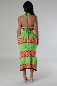 Detail of green crochet two-piece set featuring vibrant chevron patterns on the back