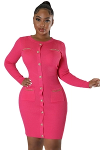 Close-up of rose pink ribbed knit dress with gold embossed buttons and chain pockets