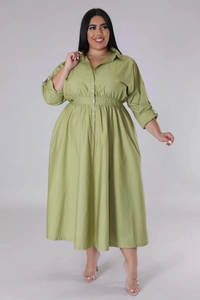 Detailed view of plus size grass green shirt dress with waist pleats and button closure