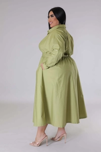 Detail of plus size lime green shirt dress showing side view with elastic waist and A-line hem