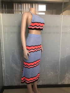Detail of blue crochet knit two-piece set featuring wavy stripes and halter neck top