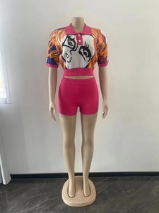 Close-up of knit two-piece set with POLO collar and cartoon graphic print detail