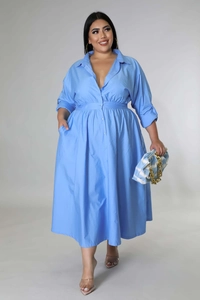 Detail of plus size sky blue shirt dress featuring waist pleats and a button-up front