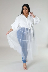 Detail of the white puff sleeves and sheer mesh overlay dress with ribbon tie waist