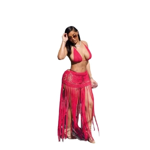 Red crochet bikini set featuring a halter top and long fringe knit beach skirt for women