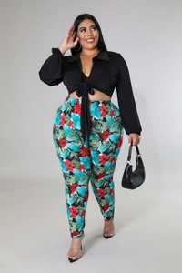 Detail of plus size tie-front V-neck top with tropical floral print high waist pants