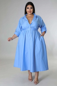 Detail of light blue plus size shirt dress showing the V-neckline and button-down front