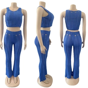Three-way view of blue knit two-piece set featuring cutout details and crop top
