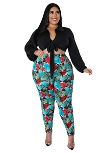 Detail of plus size two-piece set featuring tropical floral print leggings and tie-front shirt